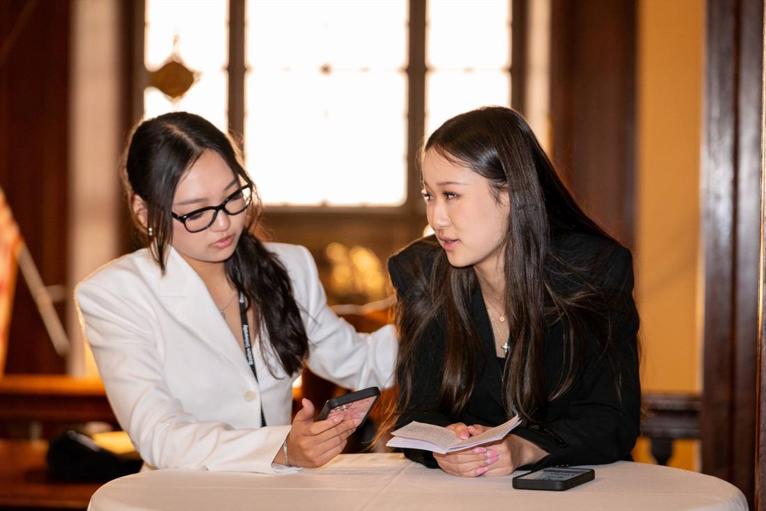 Two participants comparing notes during a SparkHub gathering
