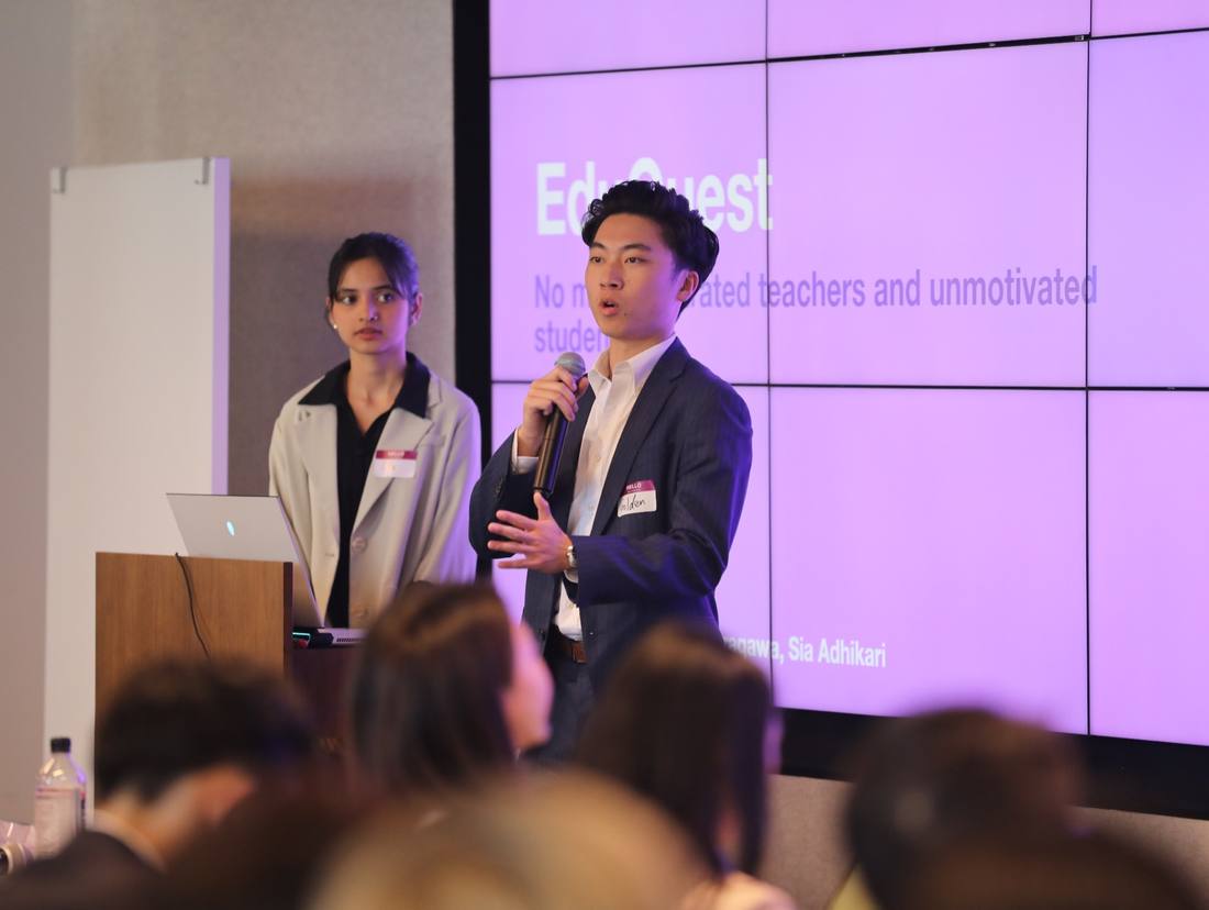 Two presenters sharing an education-focused project at a previous SparkHub event
