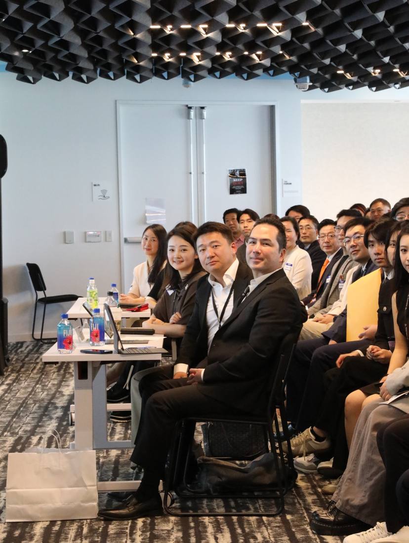 Participants and adult guests seated together during a program session