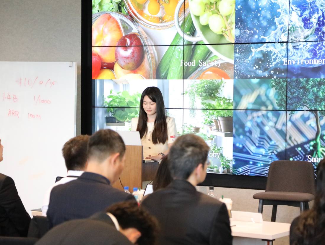 A participant presenting an idea to a seated audience