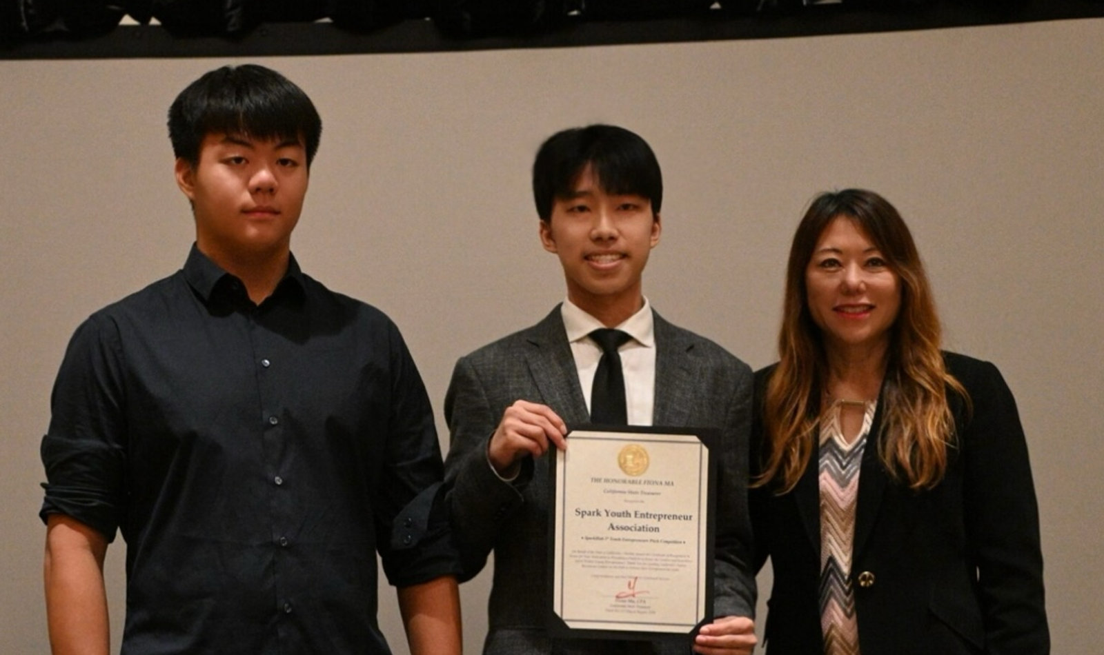 SparkHub leaders receiving a certificate of recognition