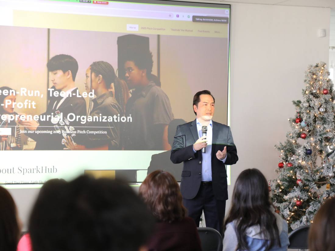 A speaker presenting to workshop attendees