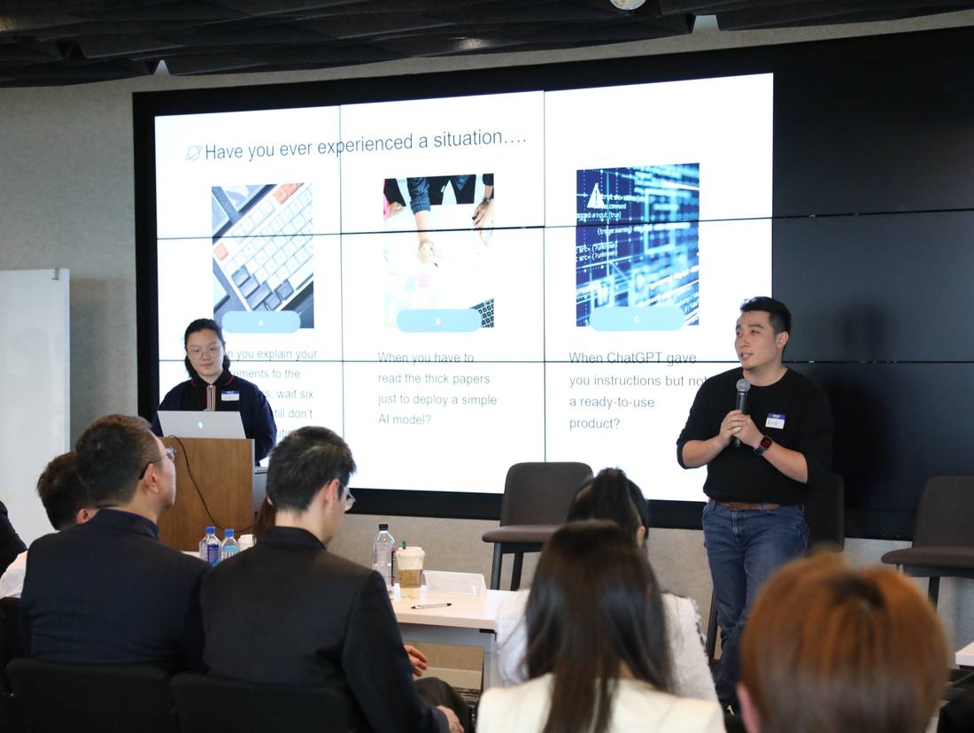 Two presenters sharing a technology idea with judges and attendees at the 2025 competition